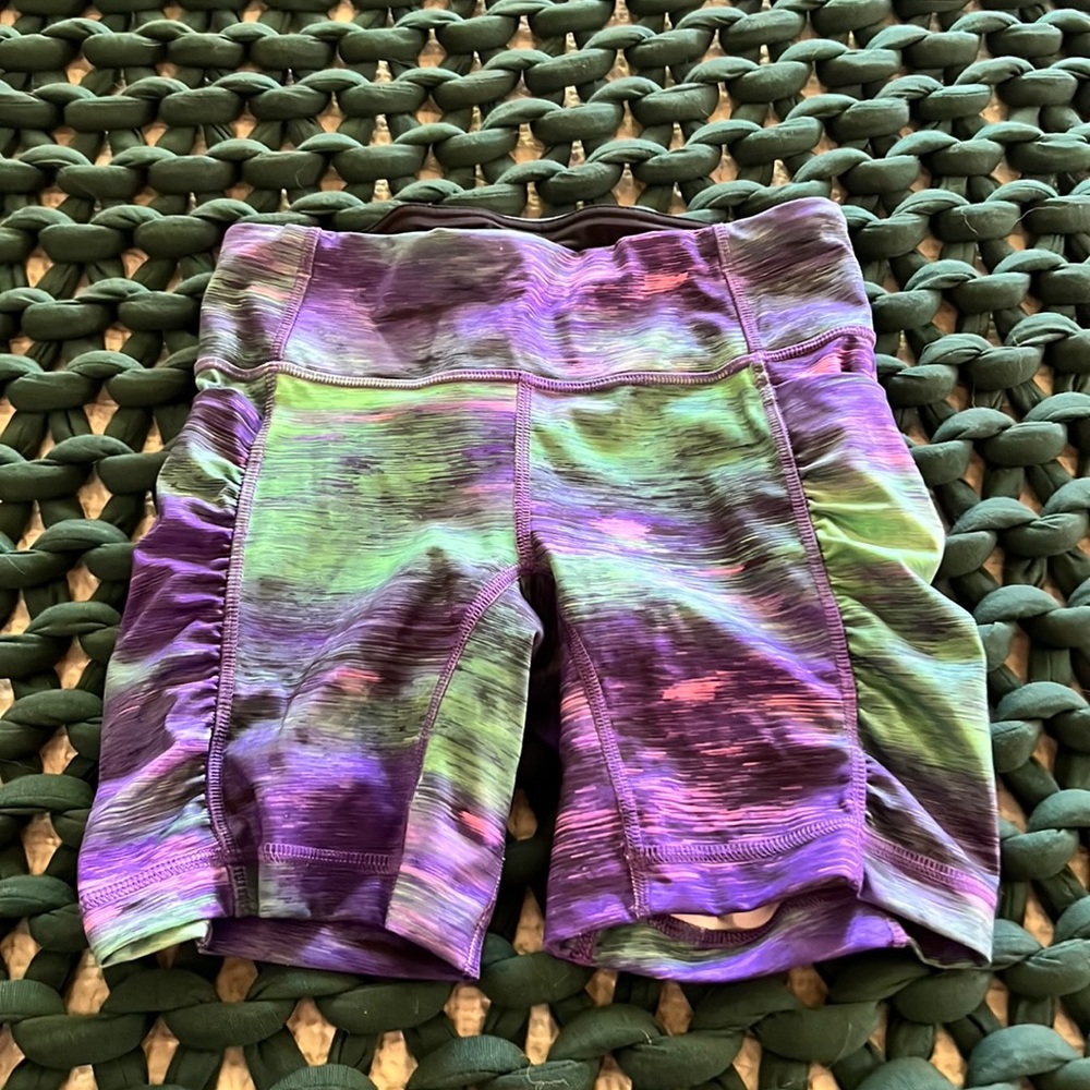 Lululemon speed track shorts in purple and green.